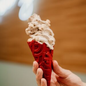 person holding ice cream cone